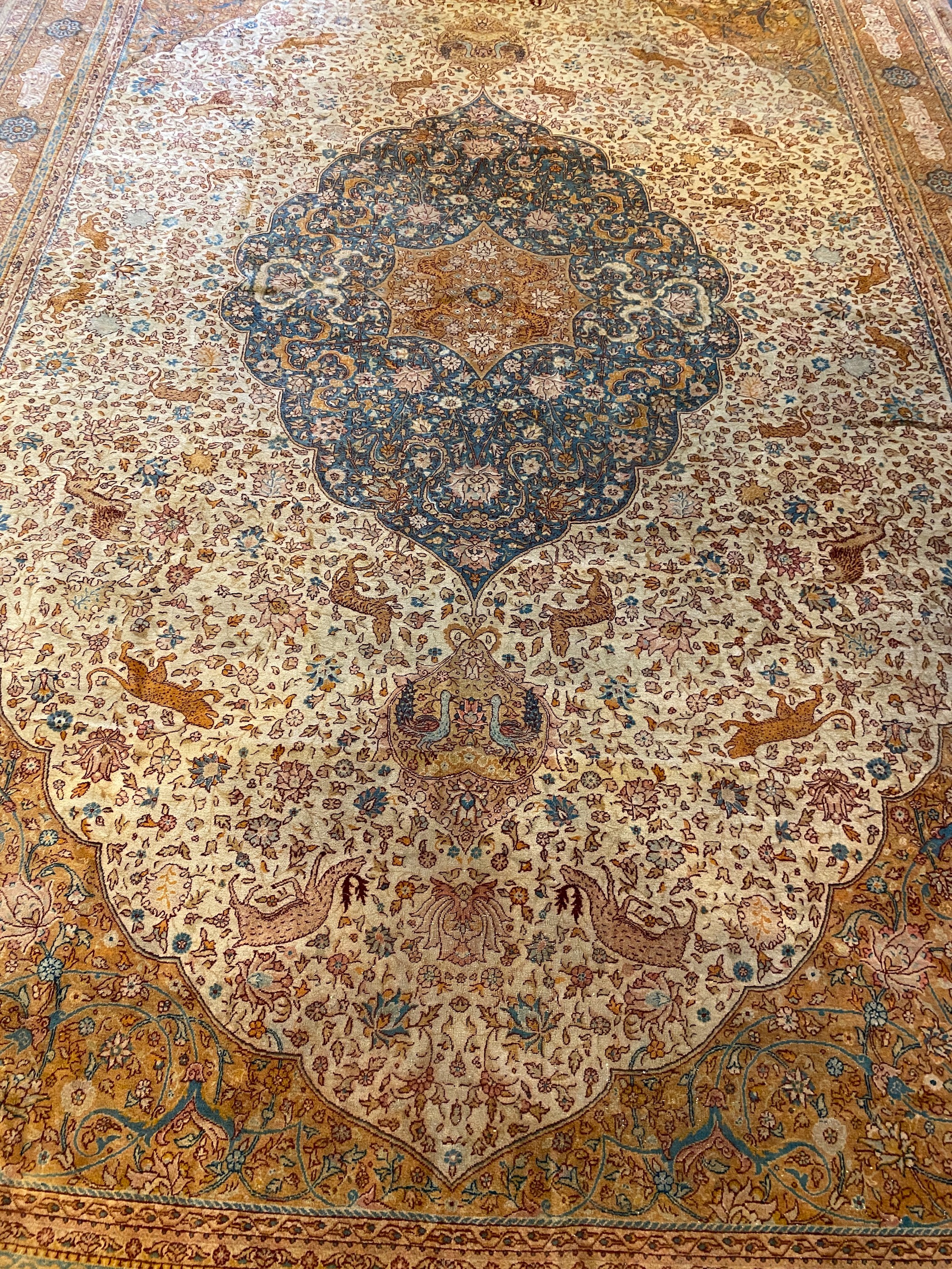 An early 20th century Tabriz ivory ground carpet, 528 x 348cm